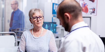 A doctor talking to a patient in a hospital